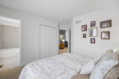 a bedroom with a bed and a shower