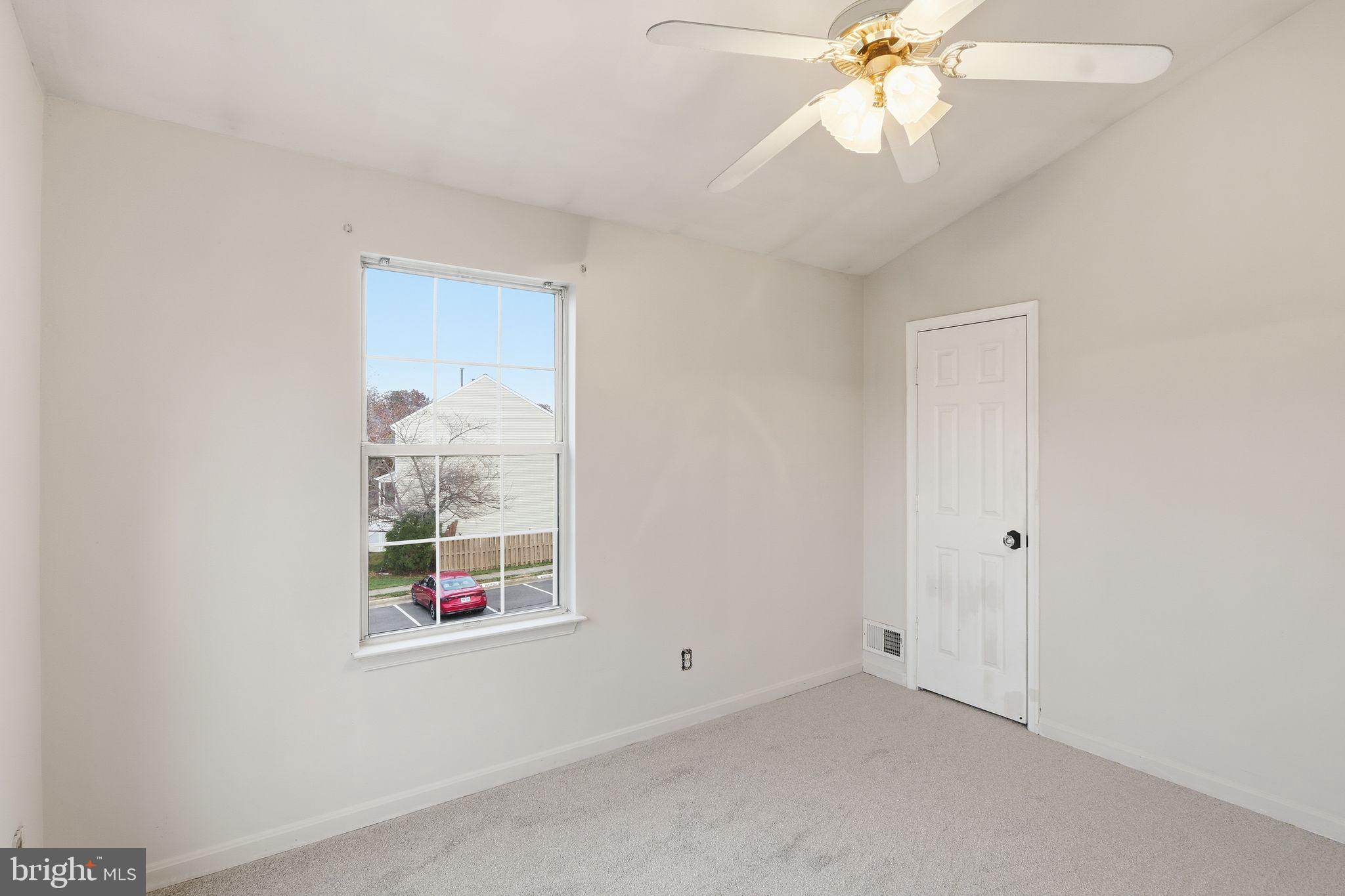 15663 Viewpoint Circle Dumfries, VA 22025 - Photo 15 of 30 an empty room with windows and fan