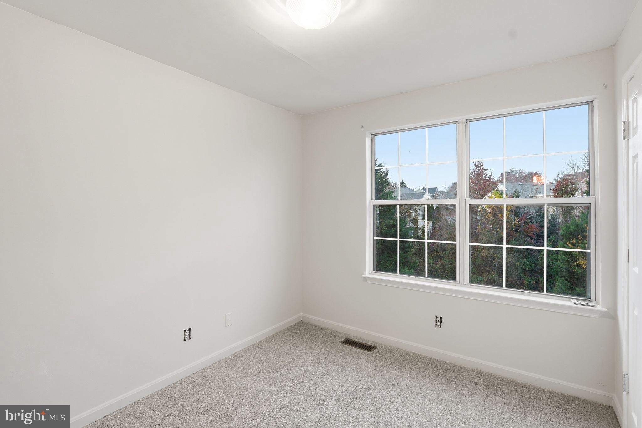 15663 Viewpoint Circle Dumfries, VA 22025 - Photo 16 of 30 a view of an empty room with a window