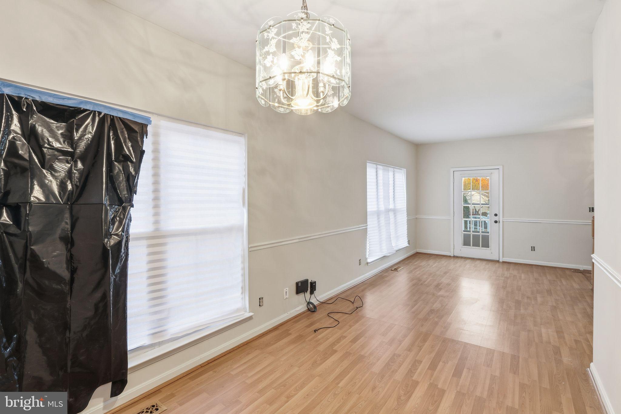 15663 Viewpoint Circle Dumfries, VA 22025 - Photo 17 of 30 wooden floor in an empty room with a window