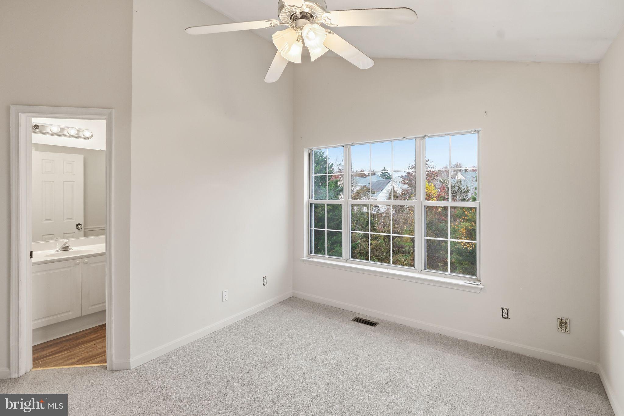 15663 Viewpoint Circle Dumfries, VA 22025 - Photo 19 of 30 an empty room with a window and a kitchen