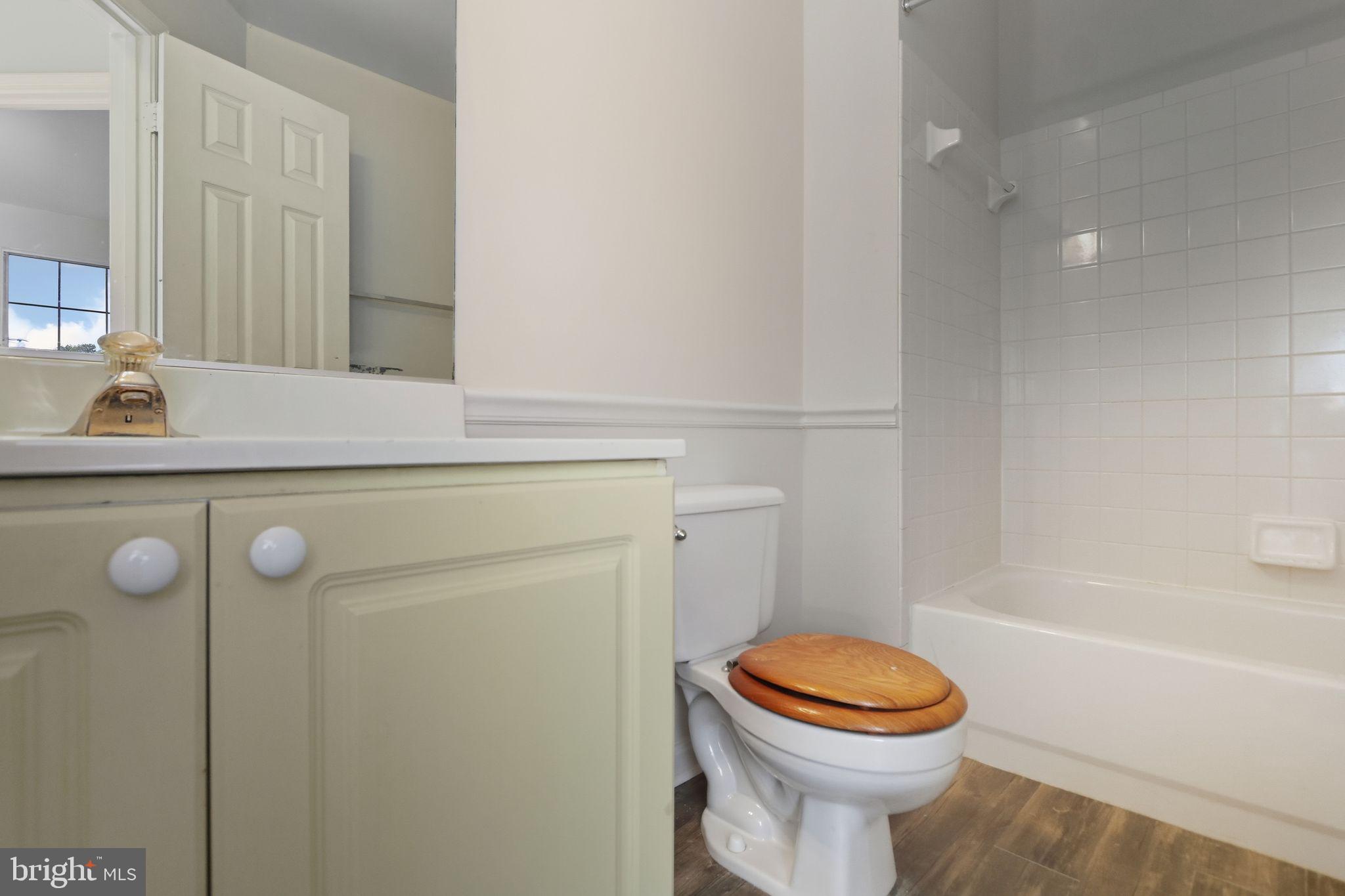 15663 Viewpoint Circle Dumfries, VA 22025 - Photo 21 of 30 a bathroom with a sink a toilet and shower
