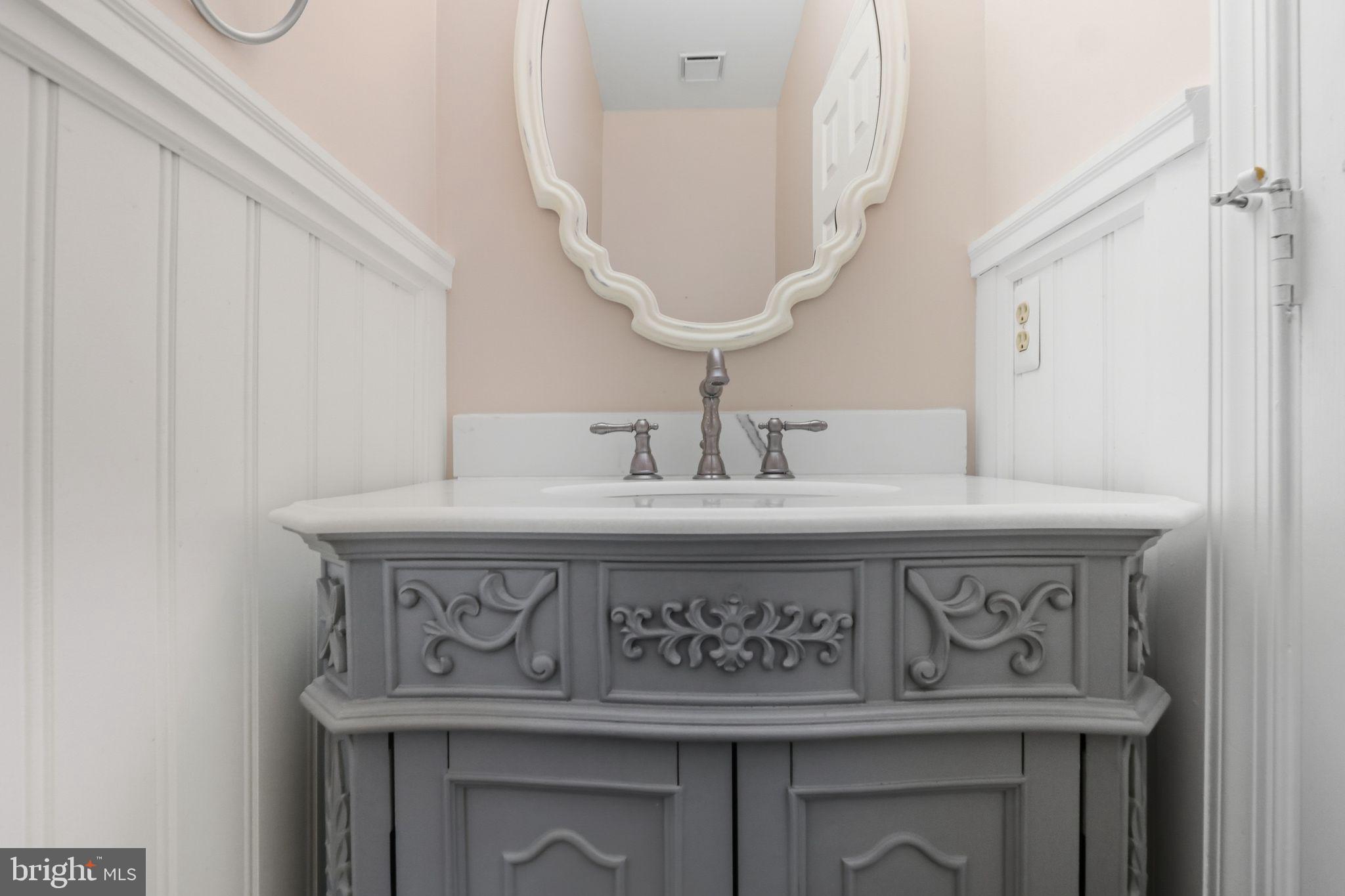 15663 Viewpoint Circle Dumfries, VA 22025 - Photo 22 of 30 a close view of a sink and a mirror in a room