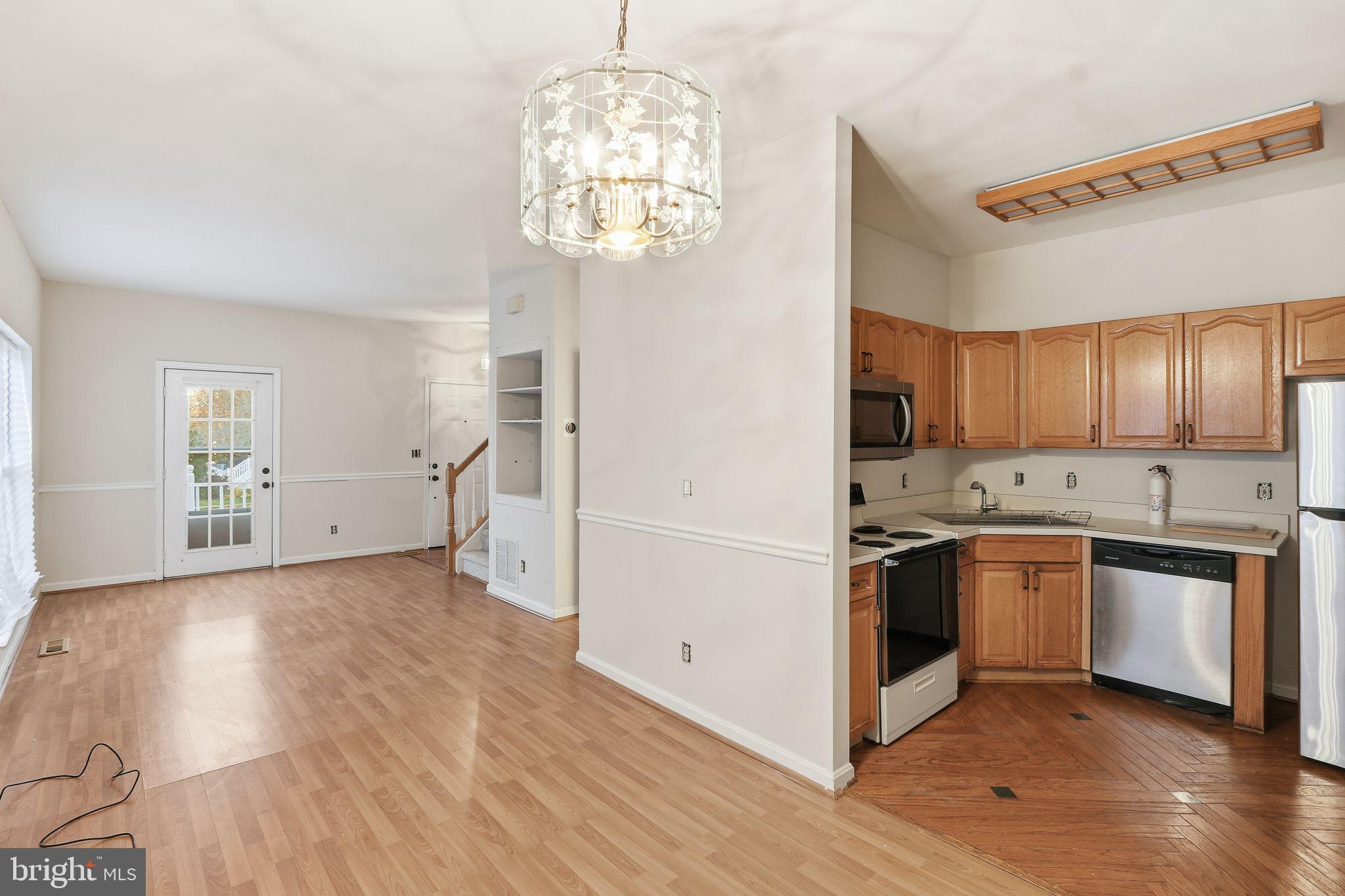15663 Viewpoint Circle Dumfries, VA 22025 - Photo 5 of 30 a kitchen with stainless steel appliances granite countertop a refrigerator and a stove top oven