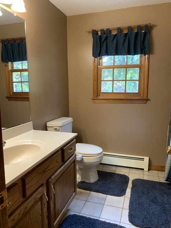 3 10 Rod Road Rutland, MA 01543 - Photo 23 of 23 a bathroom with a sink a toilet and window