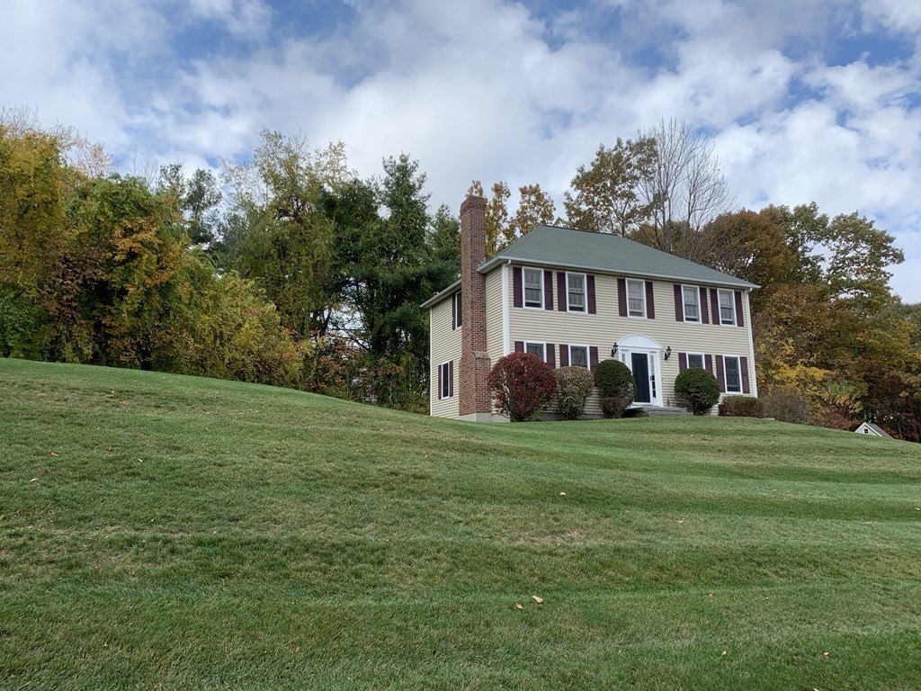 3 10 Rod Road Rutland, MA 01543 - Photo 3 of 23 a view of a house with a big yard and potted plants and large trees
