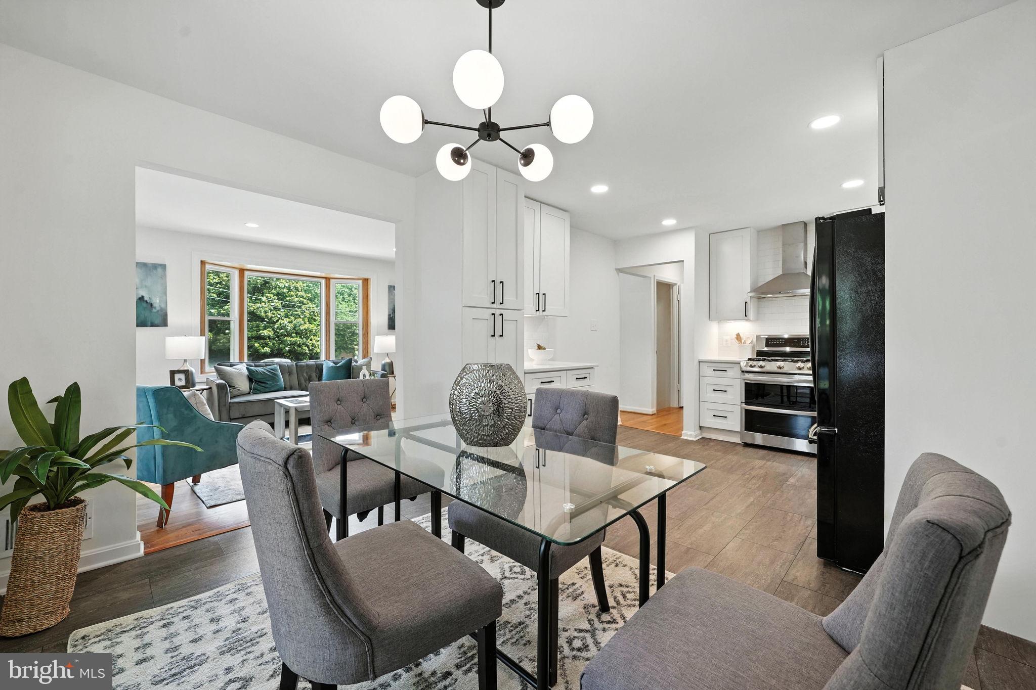 6910 Barnack Drive Springfield, VA 22152 - Photo 1 of 44 a view of a dining room with furniture window and wooden floor