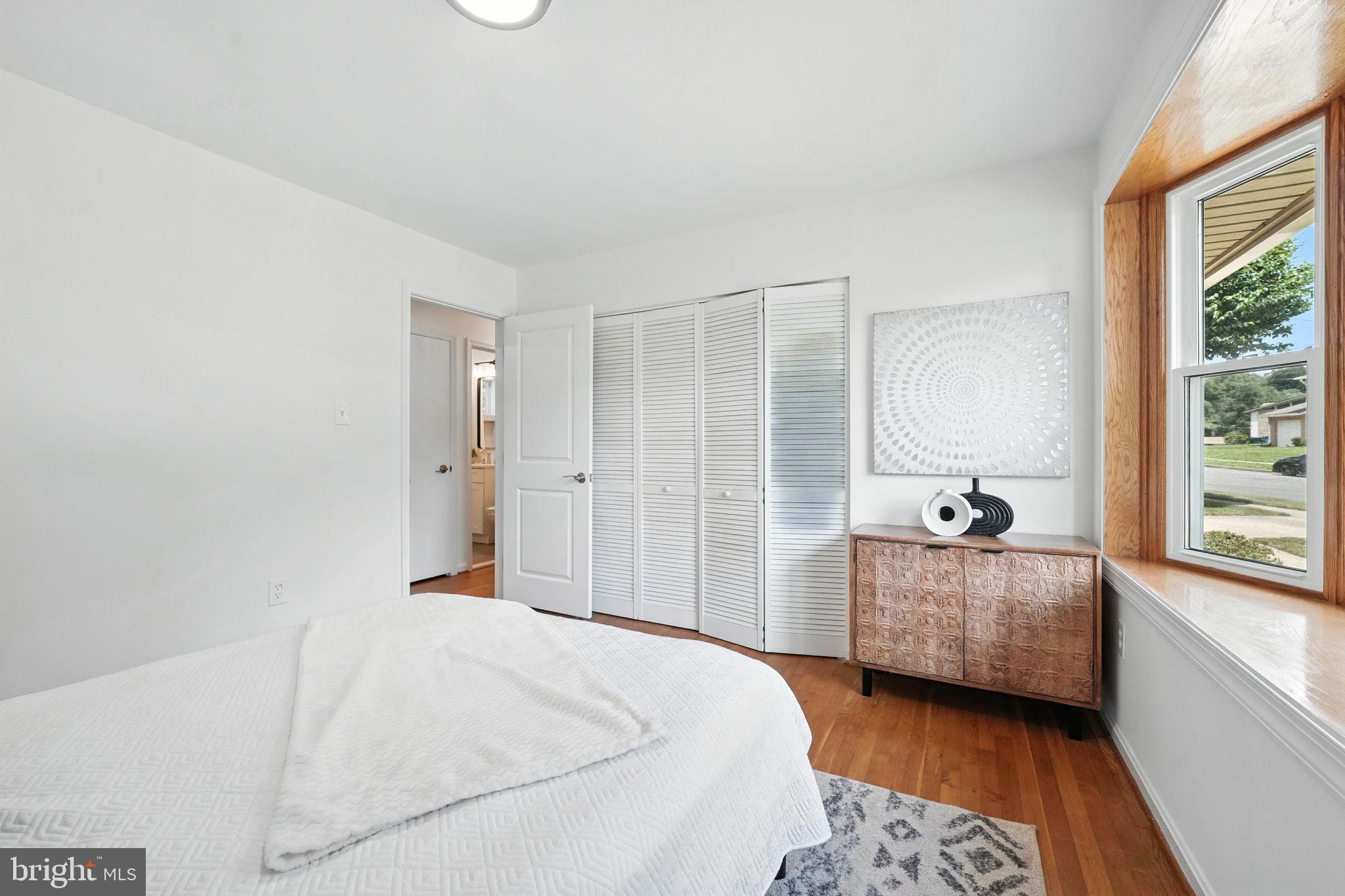 6910 Barnack Drive Springfield, VA 22152 - Photo 15 of 44 a bedroom with a bed and a couch