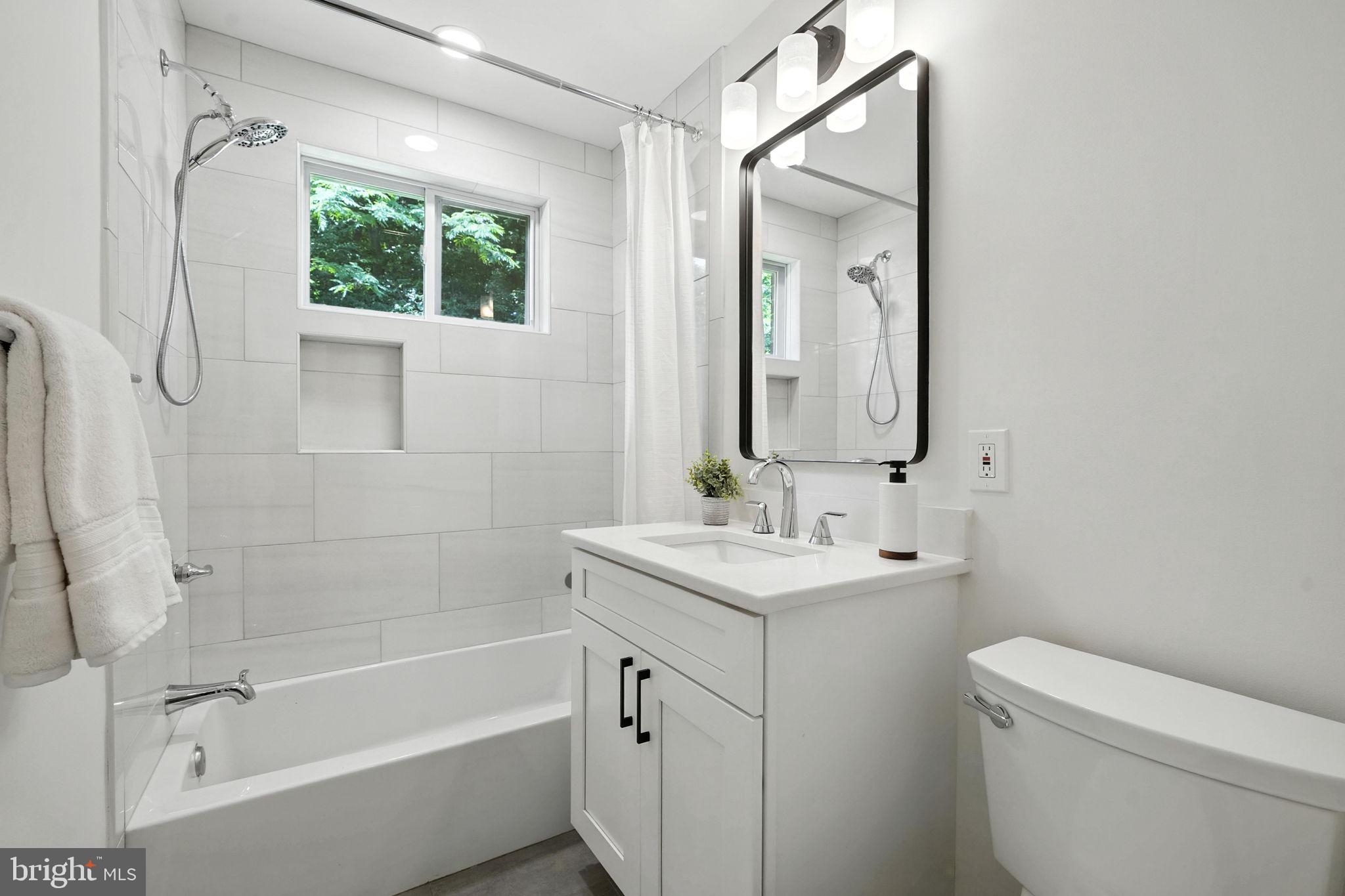 6910 Barnack Drive Springfield, VA 22152 - Photo 16 of 44 a bathroom with a sink toilet and shower