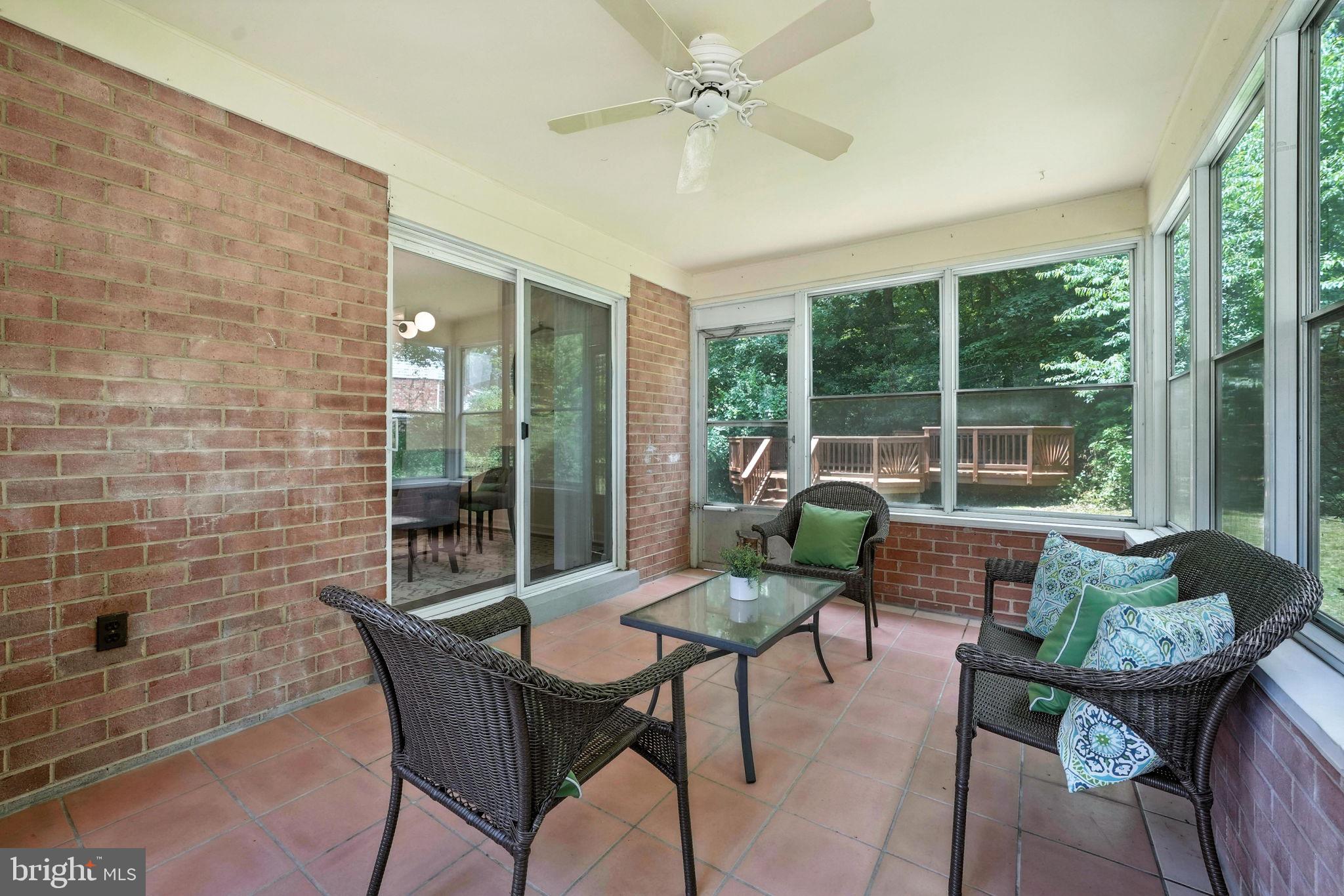 6910 Barnack Drive Springfield, VA 22152 - Photo 20 of 44 a dining room with furniture and a floor to ceiling window