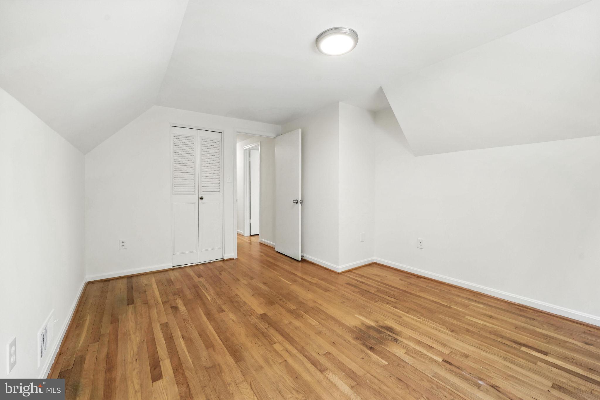 6910 Barnack Drive Springfield, VA 22152 - Photo 27 of 44 a view of empty room with wooden floor