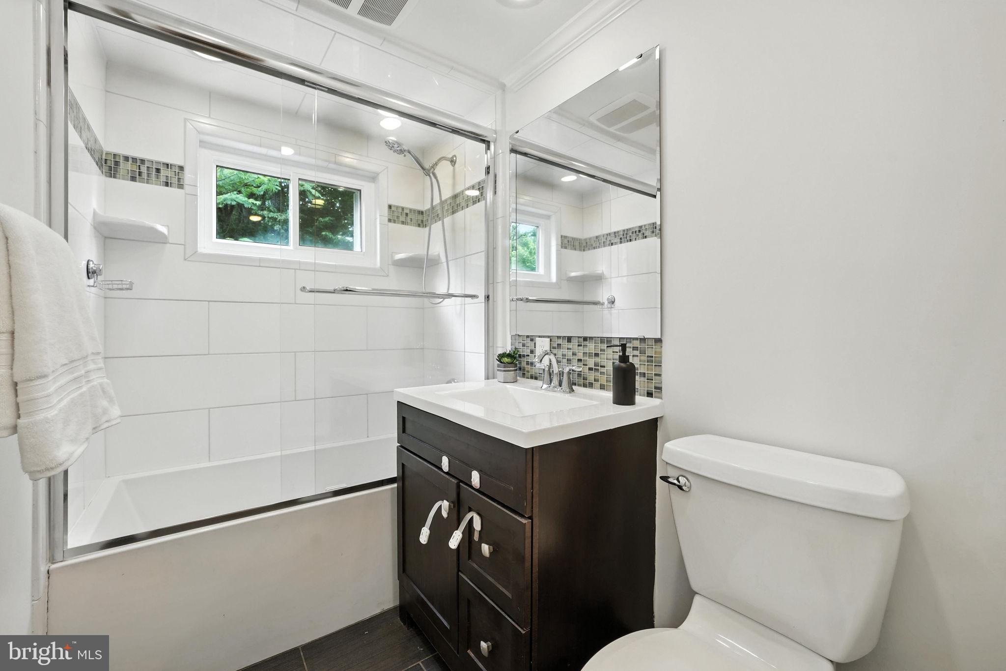 6910 Barnack Drive Springfield, VA 22152 - Photo 28 of 44 a bathroom with a sink toilet and shower