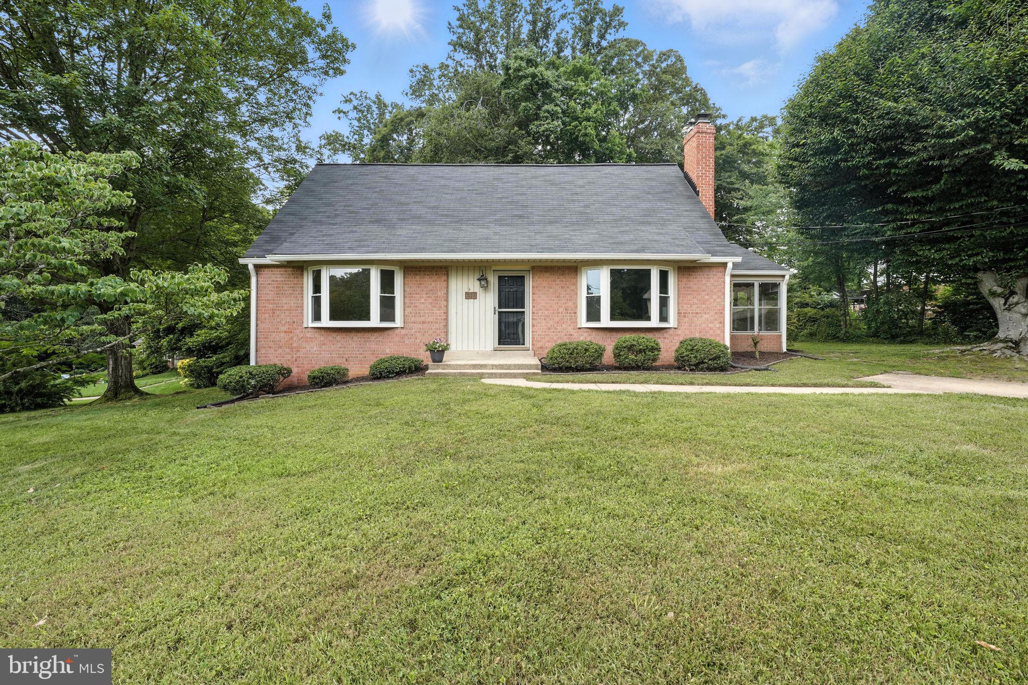 6910 Barnack Drive Springfield, VA 22152 - Photo 3 of 44 a front view of house with yard and green space