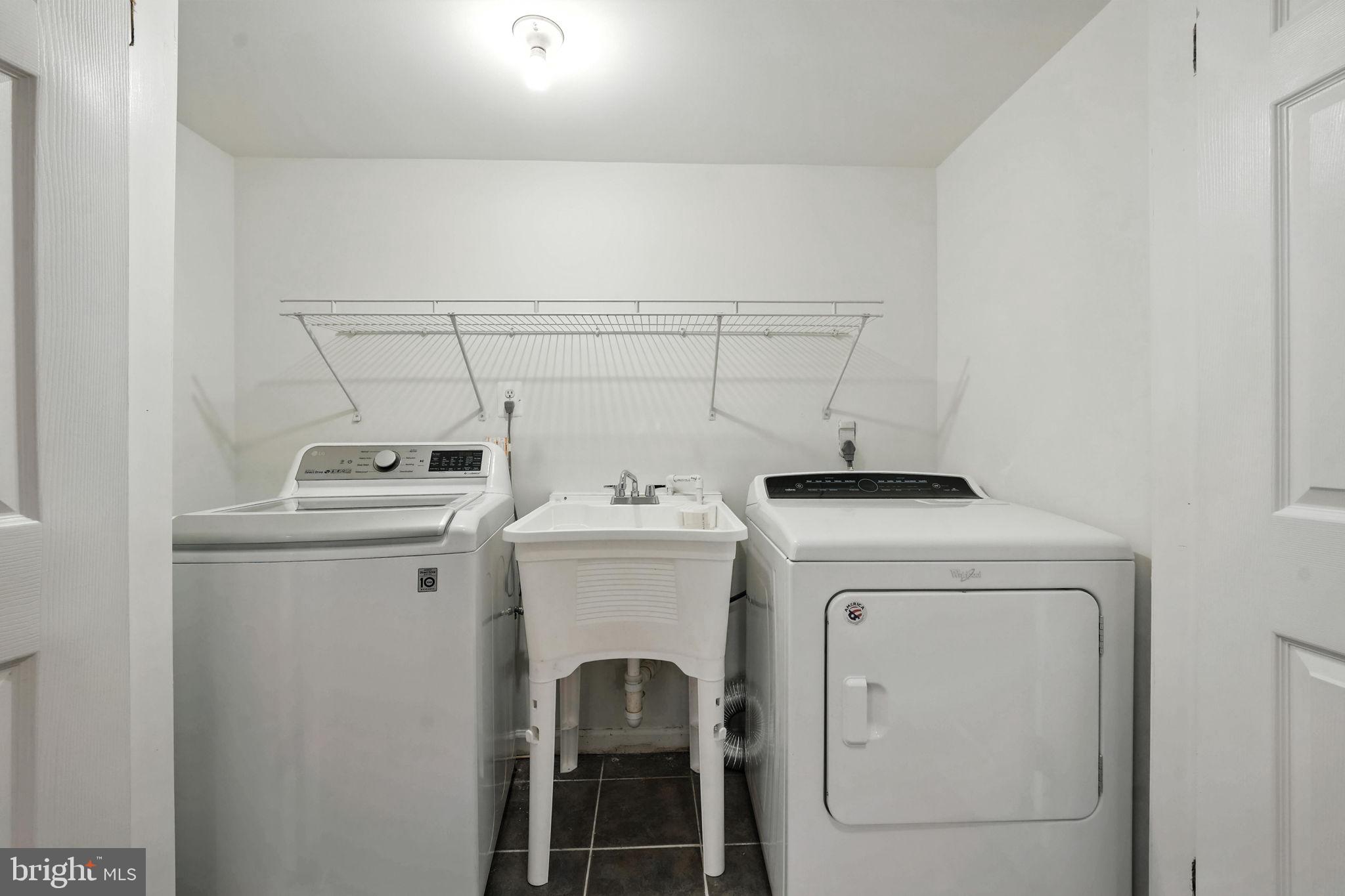 6910 Barnack Drive Springfield, VA 22152 - Photo 35 of 44 a utility room with dryer and washer