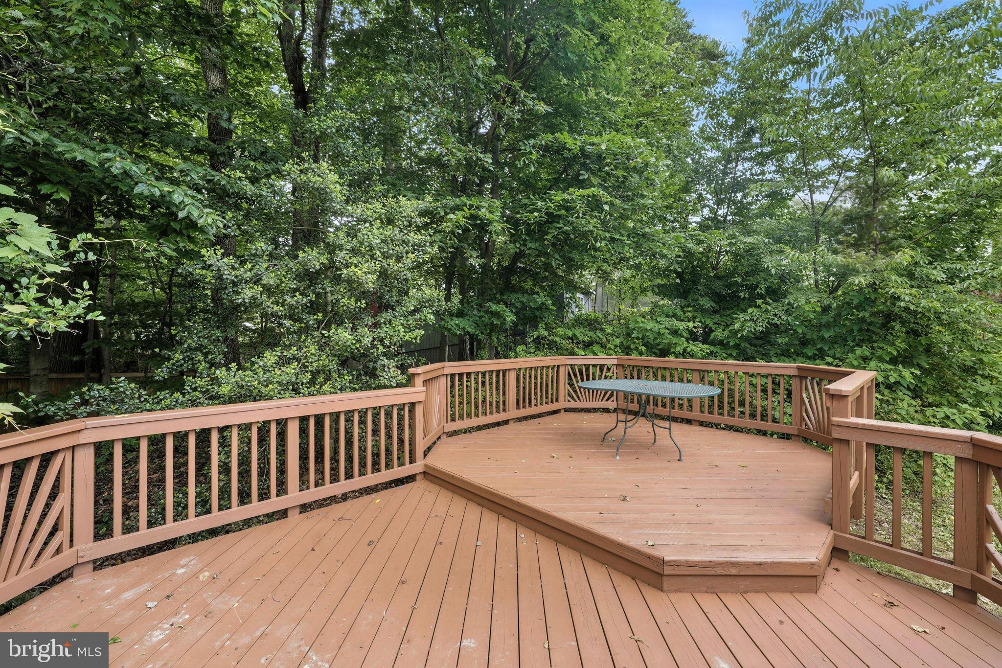 6910 Barnack Drive Springfield, VA 22152 - Photo 38 of 44 a view of balcony with wooden floor and fence