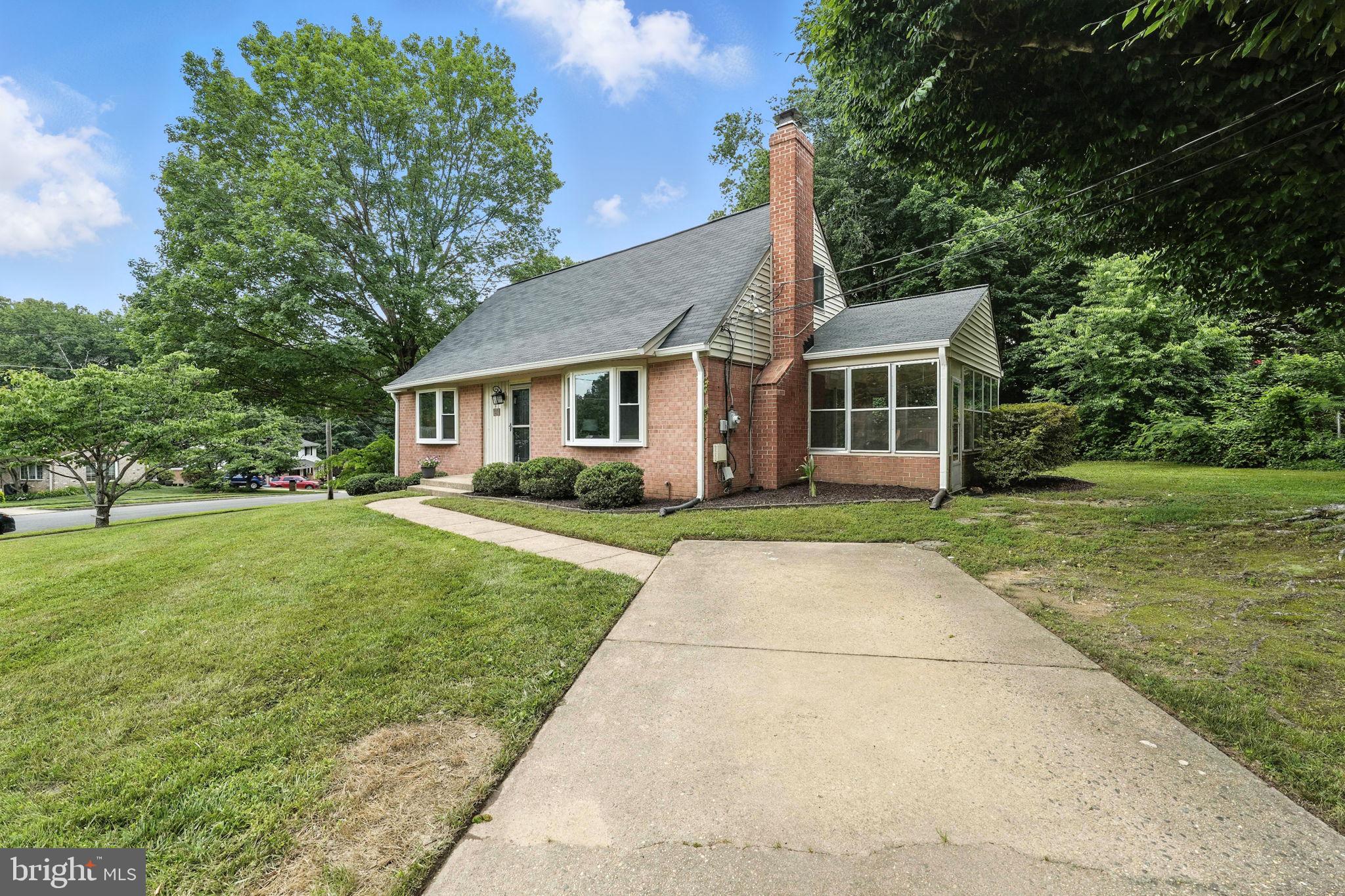 6910 Barnack Drive Springfield, VA 22152 - Photo 40 of 44 front view of house with a yard