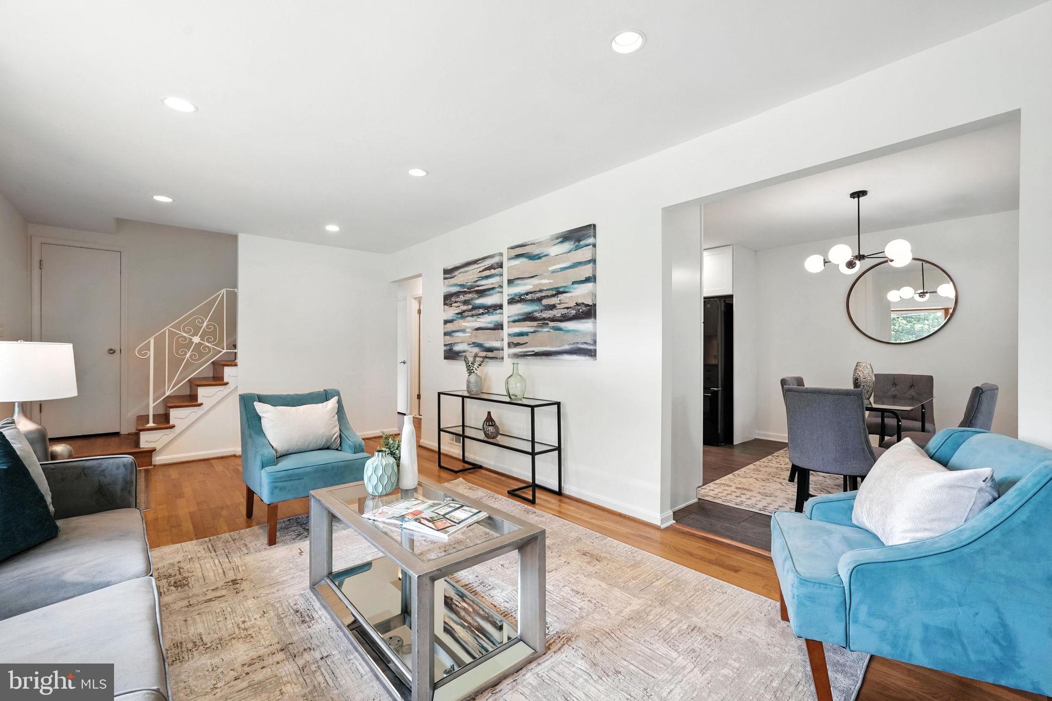 6910 Barnack Drive Springfield, VA 22152 - Photo 5 of 44 a living room with furniture a table and wooden floor