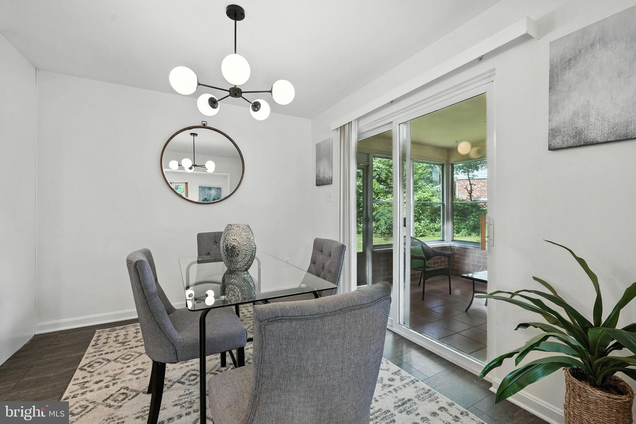 6910 Barnack Drive Springfield, VA 22152 - Photo 8 of 44 a view of a dining room with furniture window and outside view
