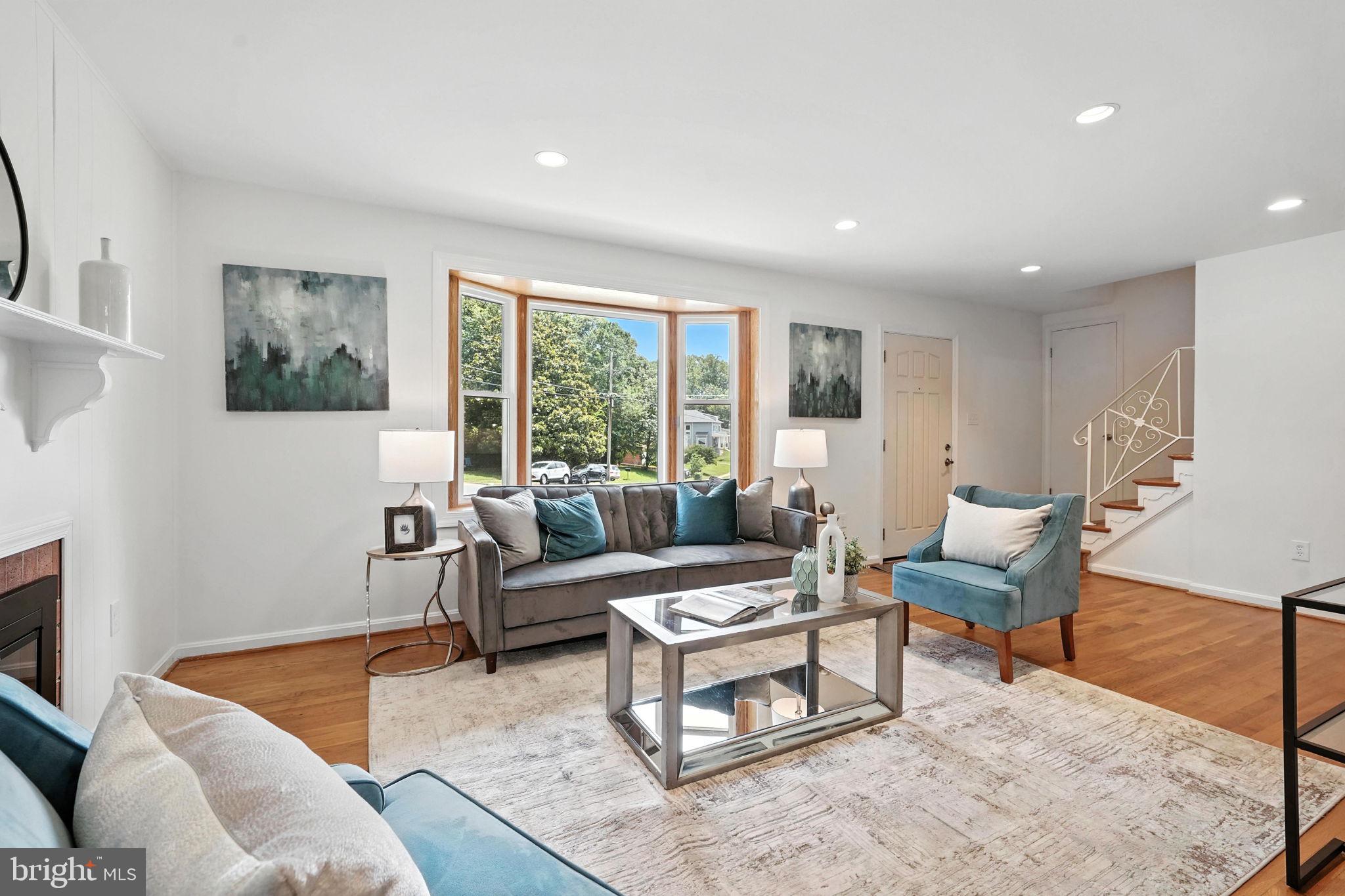 6910 Barnack Drive Springfield, VA 22152 - Photo 9 of 44 a living room with furniture and a large window
