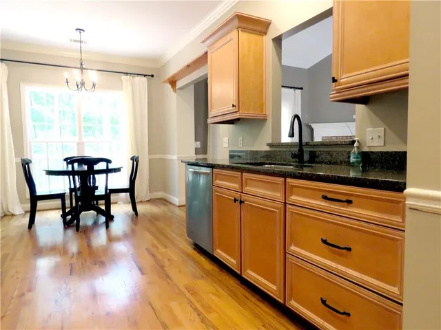 a kitchen with stainless steel appliances a refrigerator stove and microwave