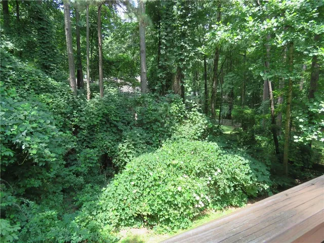 a bathroom with a tub and a window