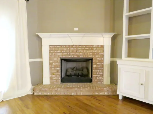 a kitchen with a refrigerator and cabinets