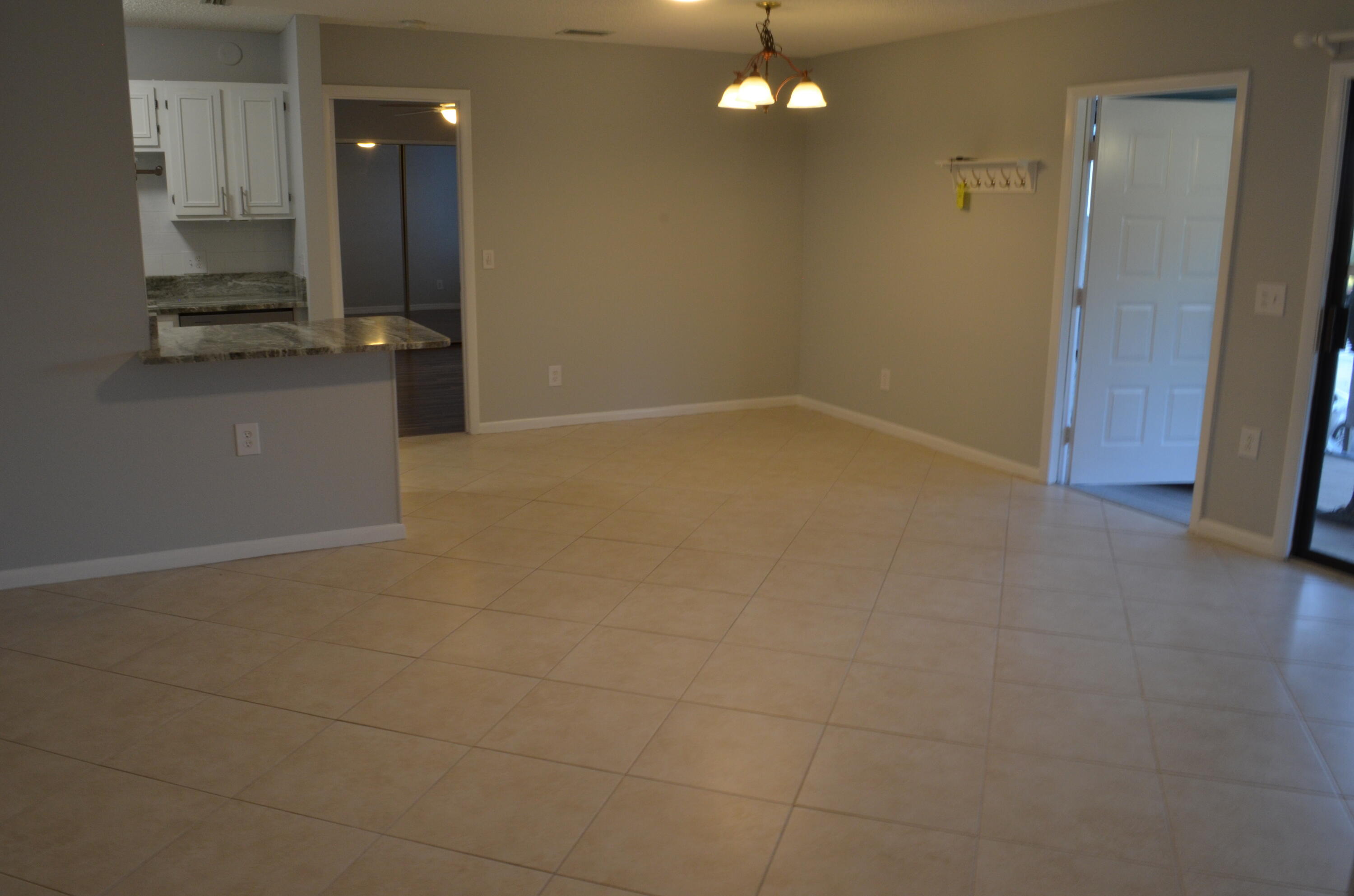 1212 Breezy Way, Unit 7H Sebastian, FL 32958 - Photo 6 of 26 an empty room with a bathroom