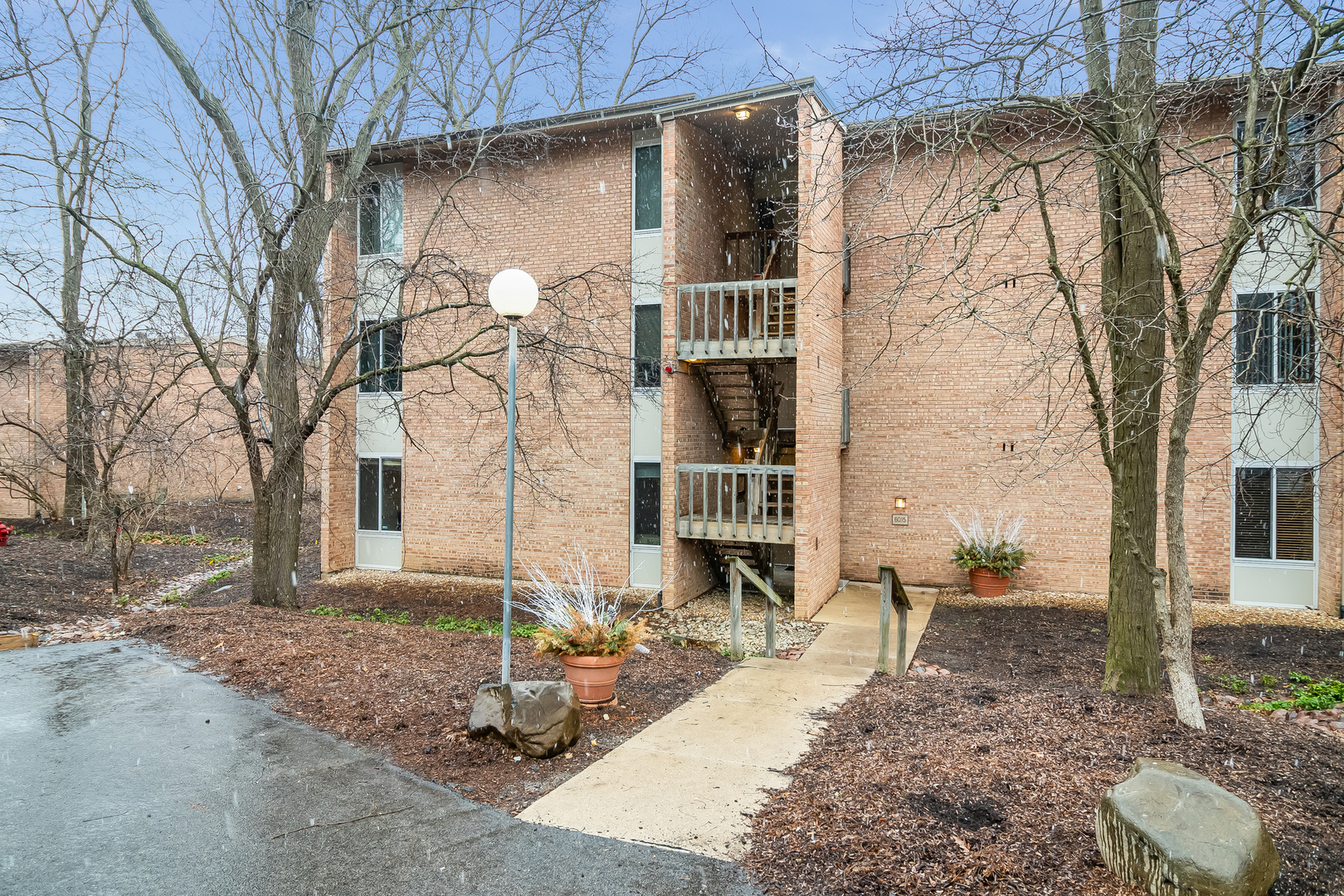 6015 Forest View Road, Unit 1A Lisle, IL 60532 - Photo 1 of 32 a backyard of a house with seating space
