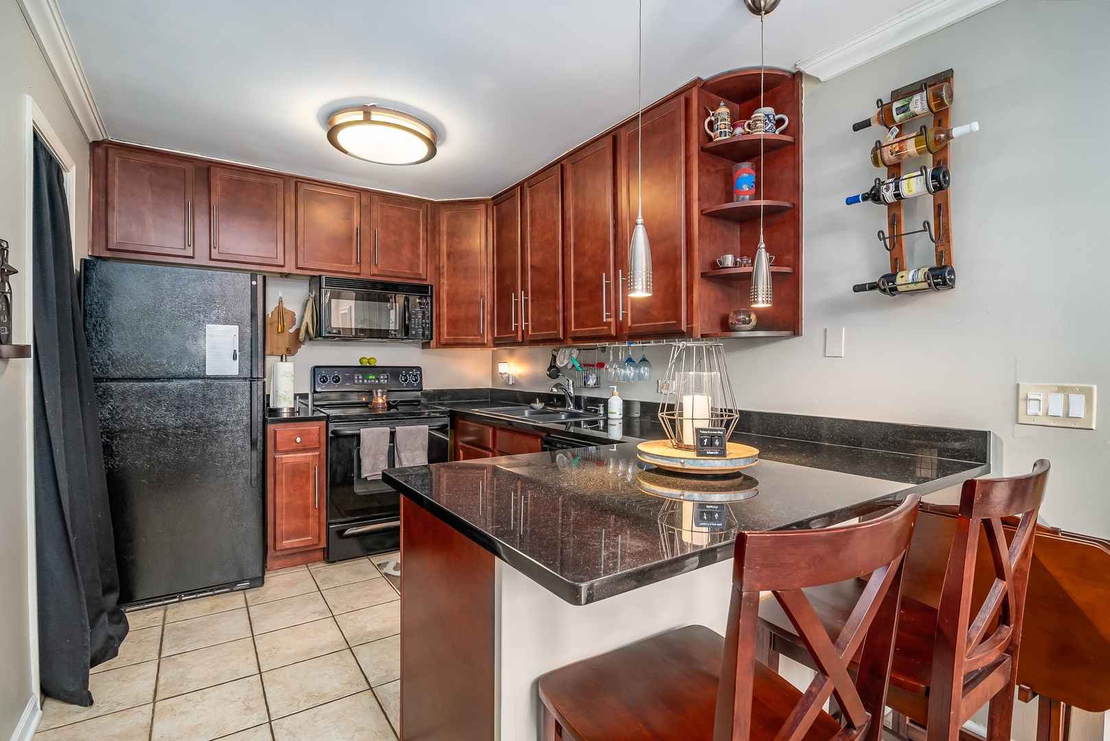 6015 Forest View Road, Unit 1A Lisle, IL 60532 - Photo 11 of 32 a kitchen with stainless steel appliances granite countertop a refrigerator and a stove top oven