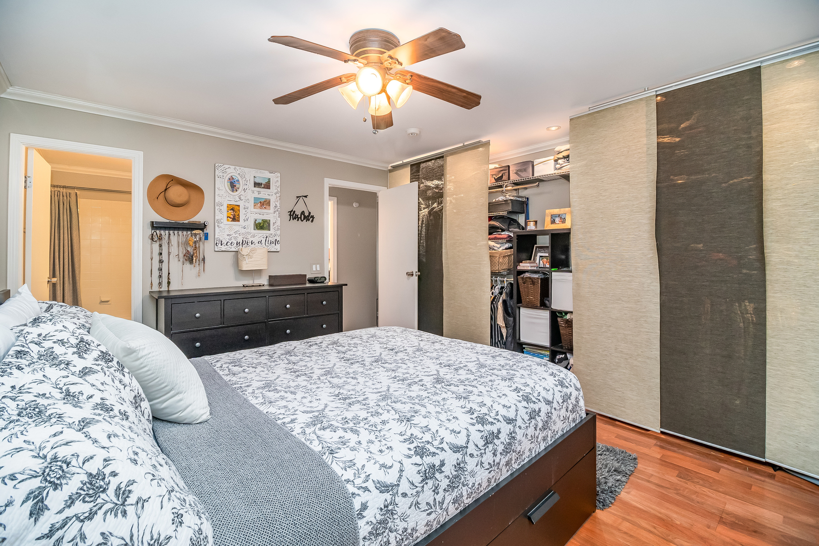 6015 Forest View Road, Unit 1A Lisle, IL 60532 - Photo 15 of 32 a bed room with a bed and a dresser