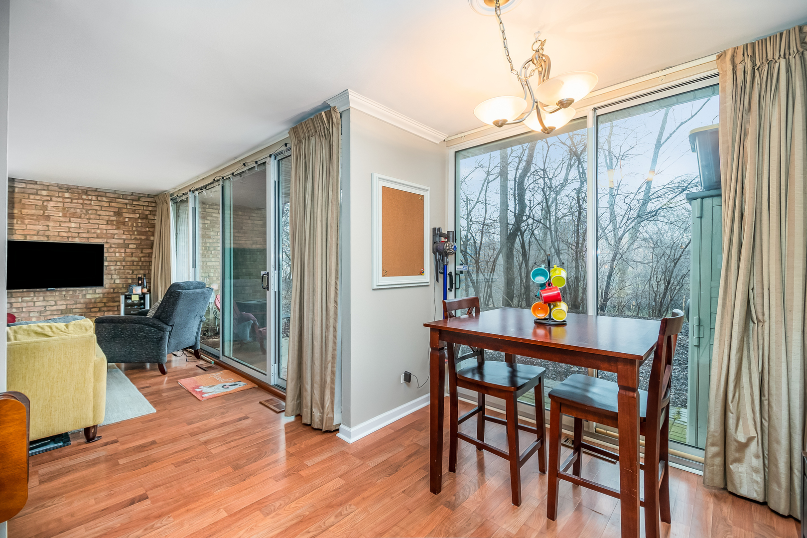 6015 Forest View Road, Unit 1A Lisle, IL 60532 - Photo 7 of 32 a dining room with furniture and wooden floor