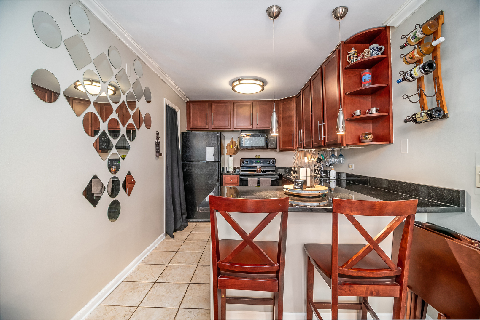6015 Forest View Road, Unit 1A Lisle, IL 60532 - Photo 10 of 32 a kitchen with stainless steel appliances granite countertop a refrigerator and a stove top oven