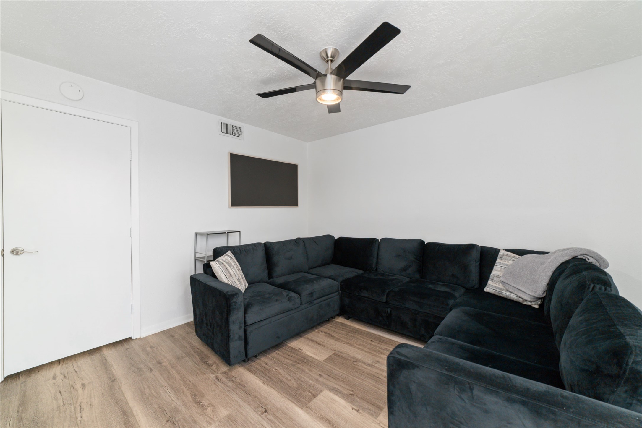 717 Davis Road League City, TX 77573 - Photo 15 of 32 a living room with couches and a flat screen tv