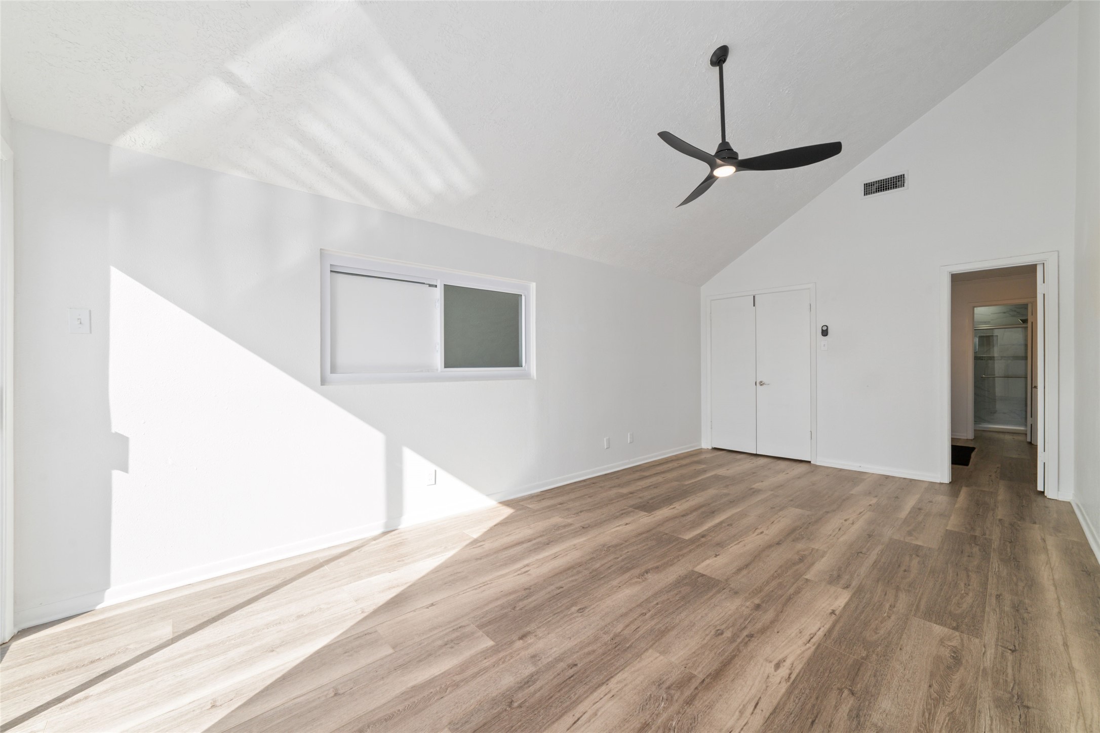 717 Davis Road League City, TX 77573 - Photo 22 of 32 a view of an empty room with wooden floor and a window