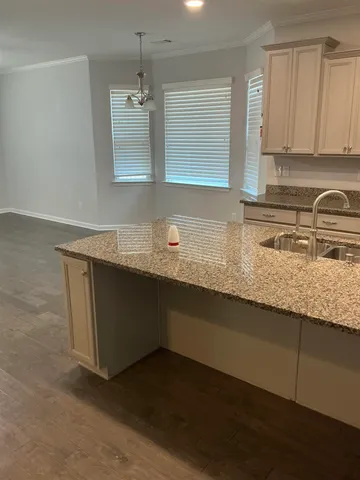 a white toilet and tub sitting next to a bathroom sink