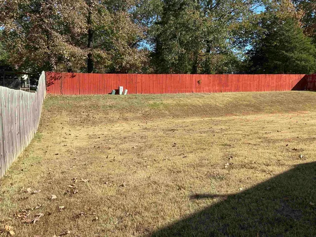 a view of a backyard of the house