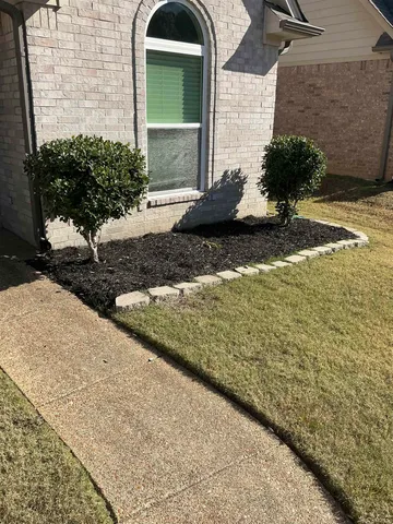 a view of a kitchen with kitchen island a sink wooden floor and a large window