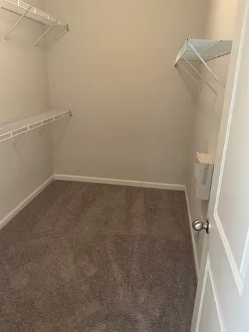 a kitchen with a refrigerator and cabinets