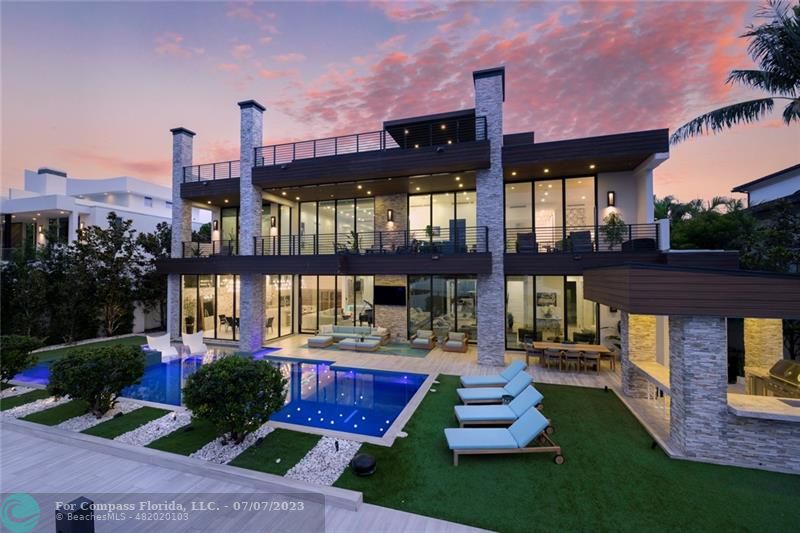 2437 Delmar Place Fort Lauderdale, FL 33301 - Photo 1 of 100 a front view of a house with a yard garden and outdoor seating