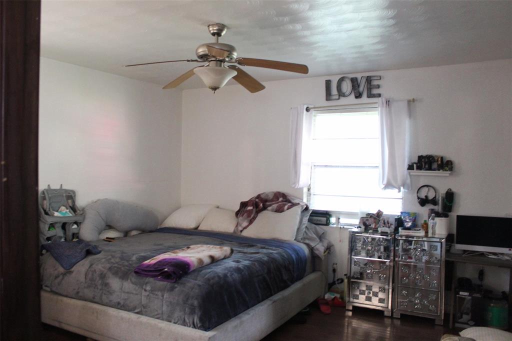 612 Ranier Circle Garland, TX 75041 - Photo 11 of 29 a bedroom with a bed and a window