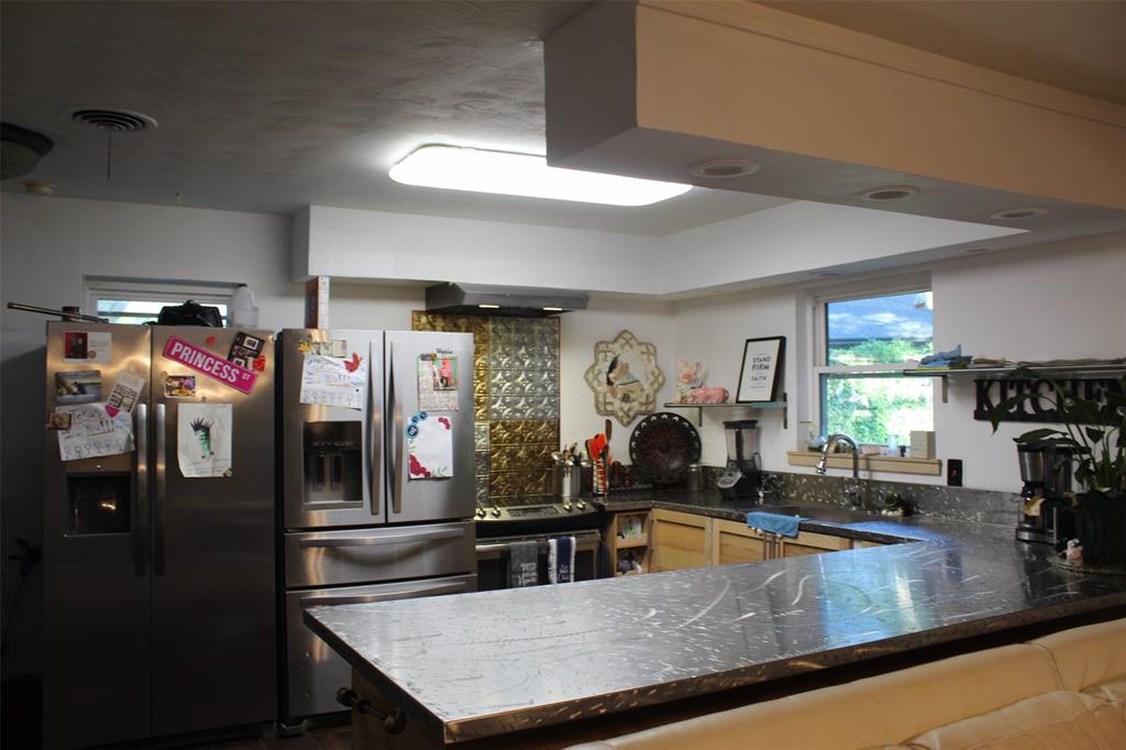612 Ranier Circle Garland, TX 75041 - Photo 17 of 29 a view of a living room and kitchen
