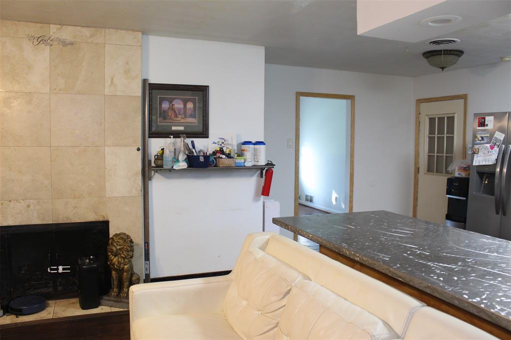 612 Ranier Circle Garland, TX 75041 - Photo 22 of 29 a bedroom with a bed and wooden floor