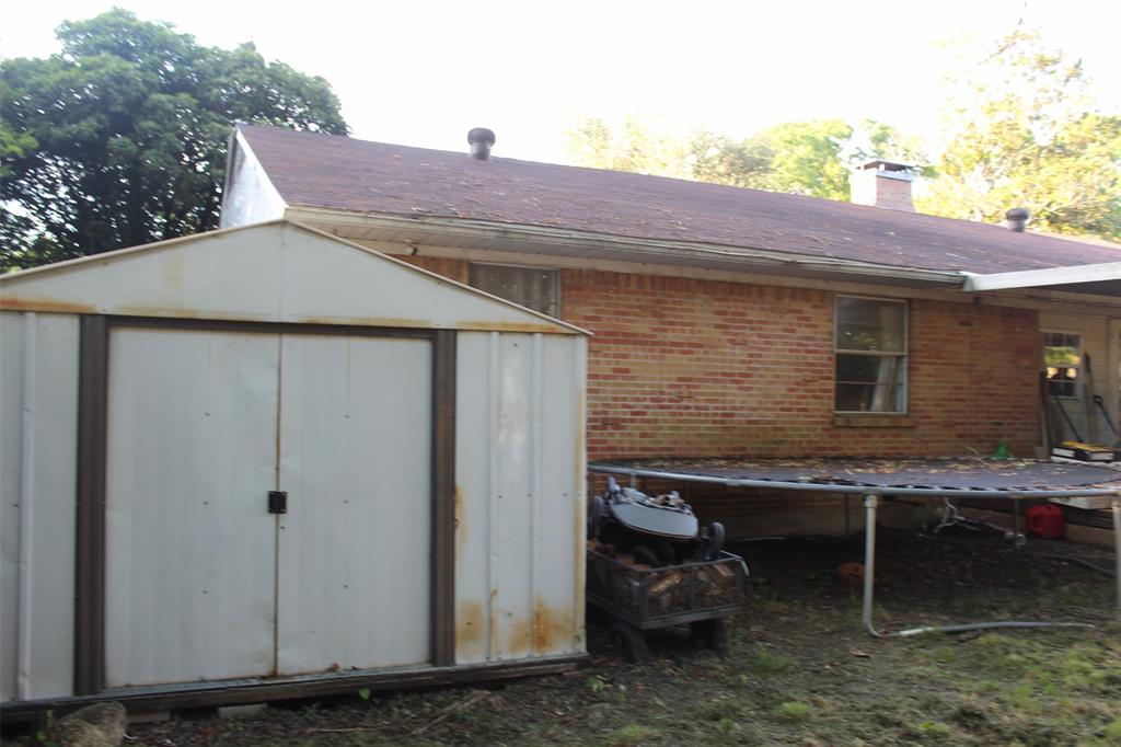 612 Ranier Circle Garland, TX 75041 - Photo 26 of 29 a backyard of a house with yard barbeque oven and outdoor seating