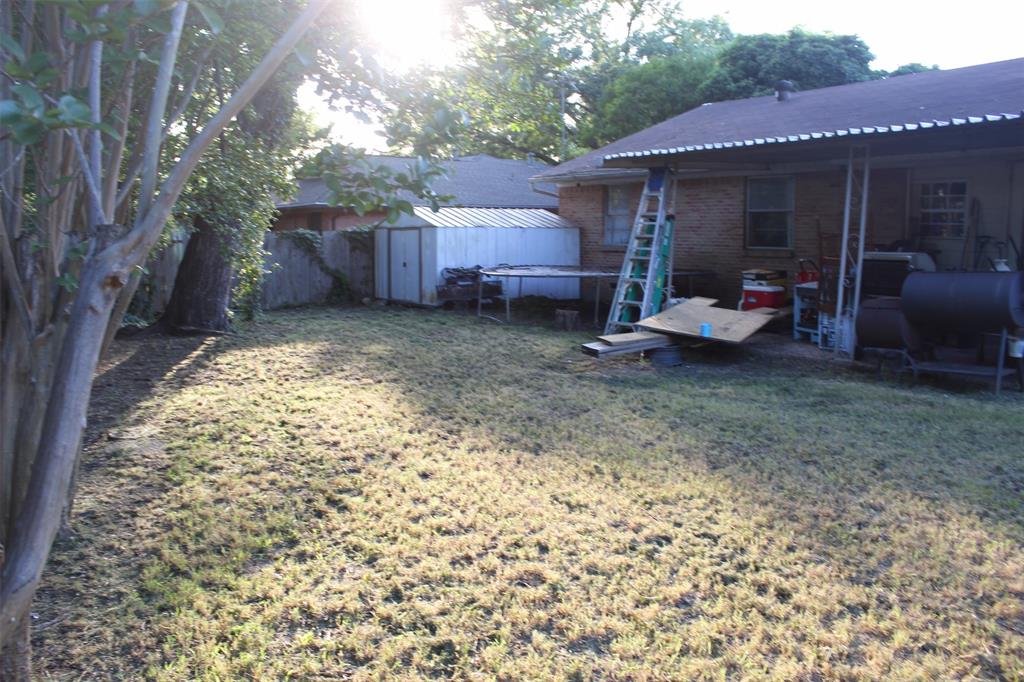 612 Ranier Circle Garland, TX 75041 - Photo 28 of 29 a view of a house with backyard