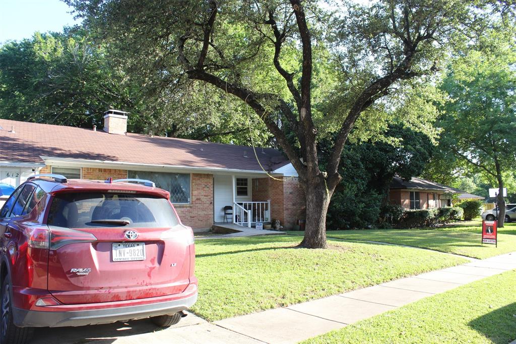 612 Ranier Circle Garland, TX 75041 - Photo 3 of 29 a front view of a house with garden