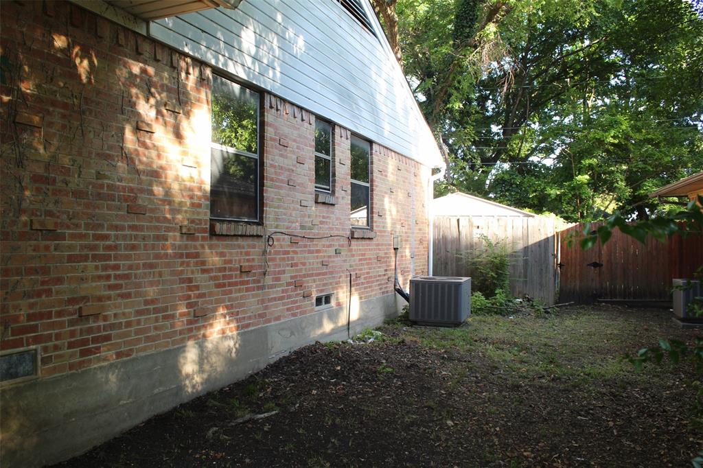 612 Ranier Circle Garland, TX 75041 - Photo 7 of 29 a view of a back yard with patio