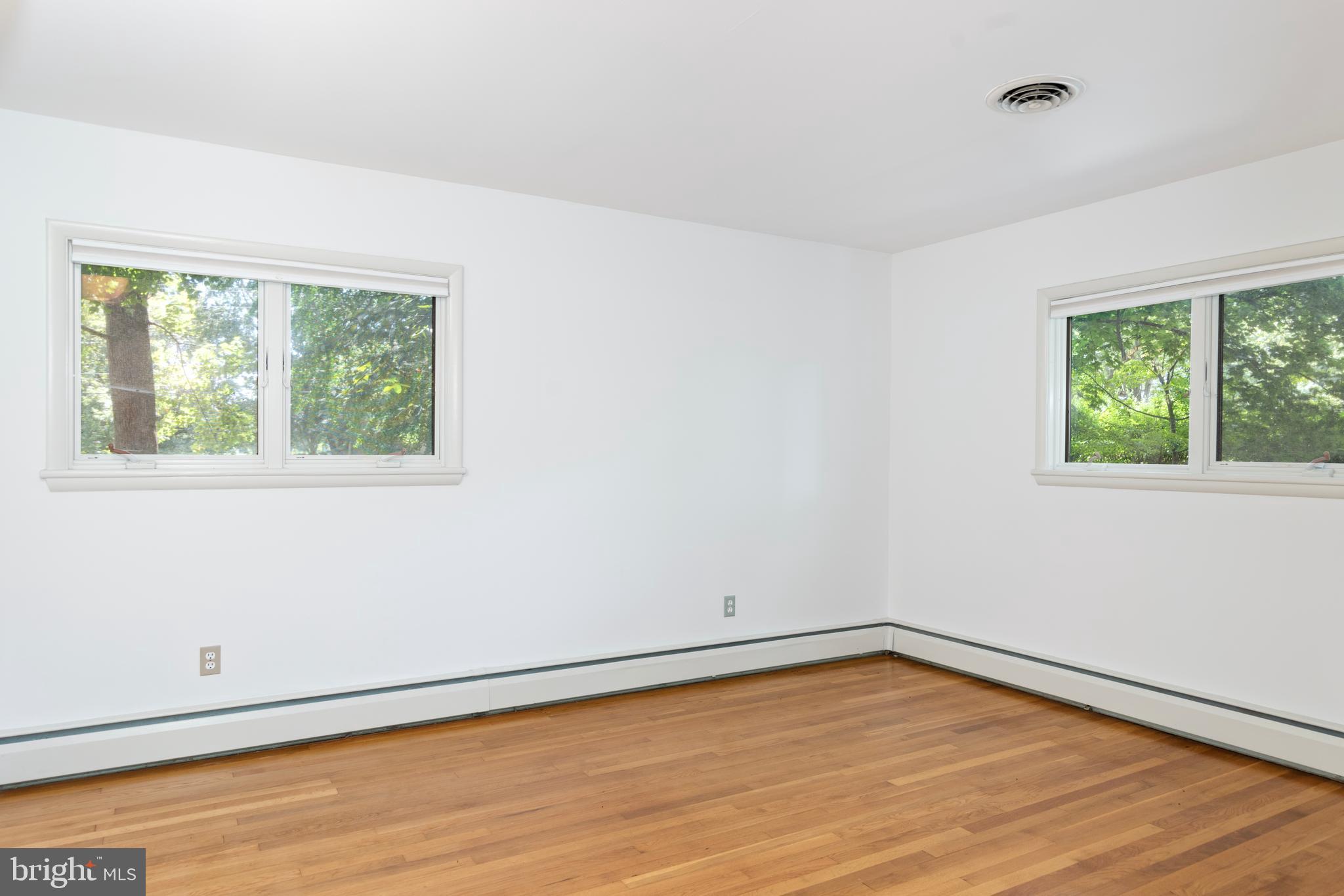 25800 Collins Avenue Chestertown, MD 21620 - Photo 14 of 31 a view of an empty room with wooden floor and a window
