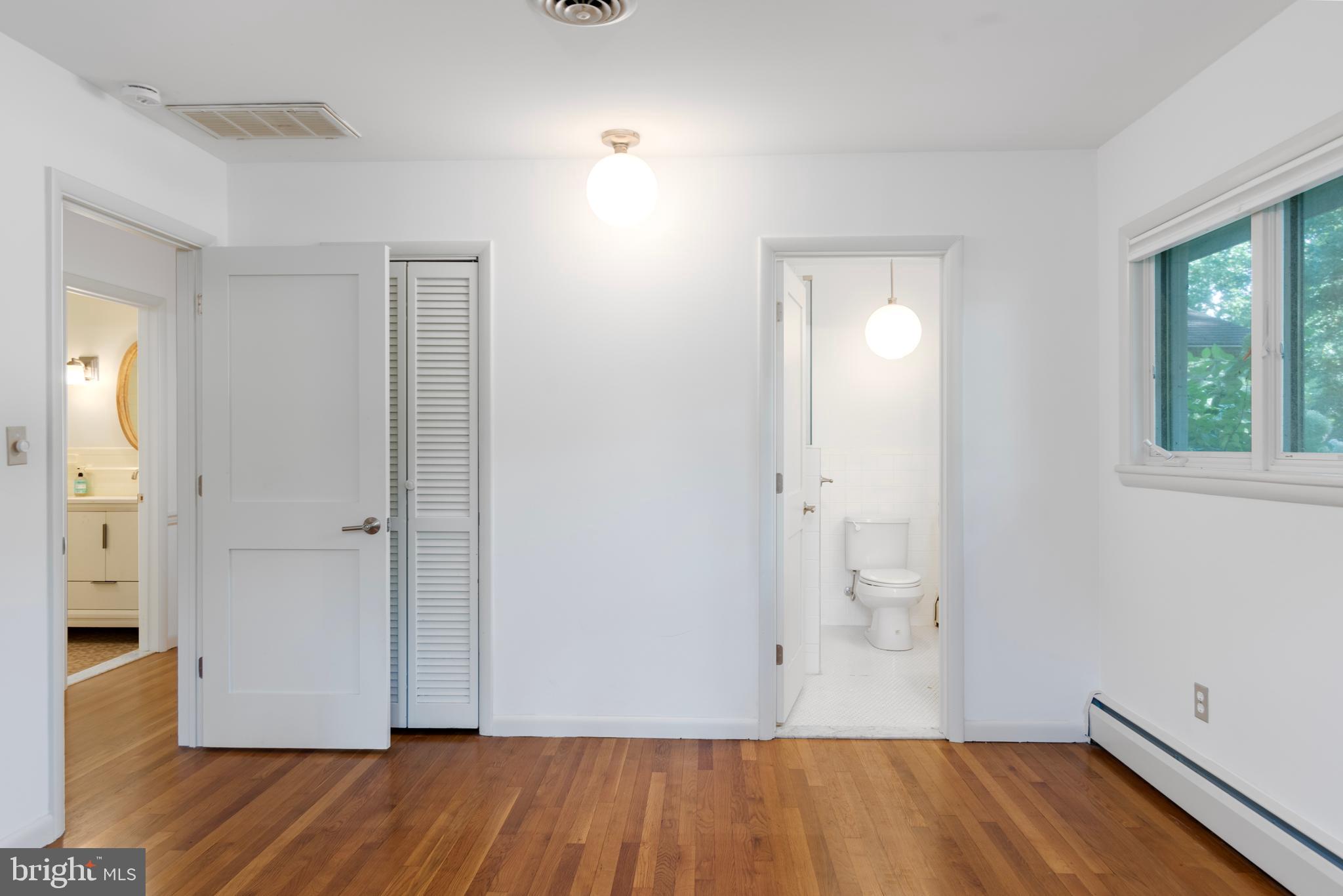 25800 Collins Avenue Chestertown, MD 21620 - Photo 15 of 31 an empty room with wooden floor and windows