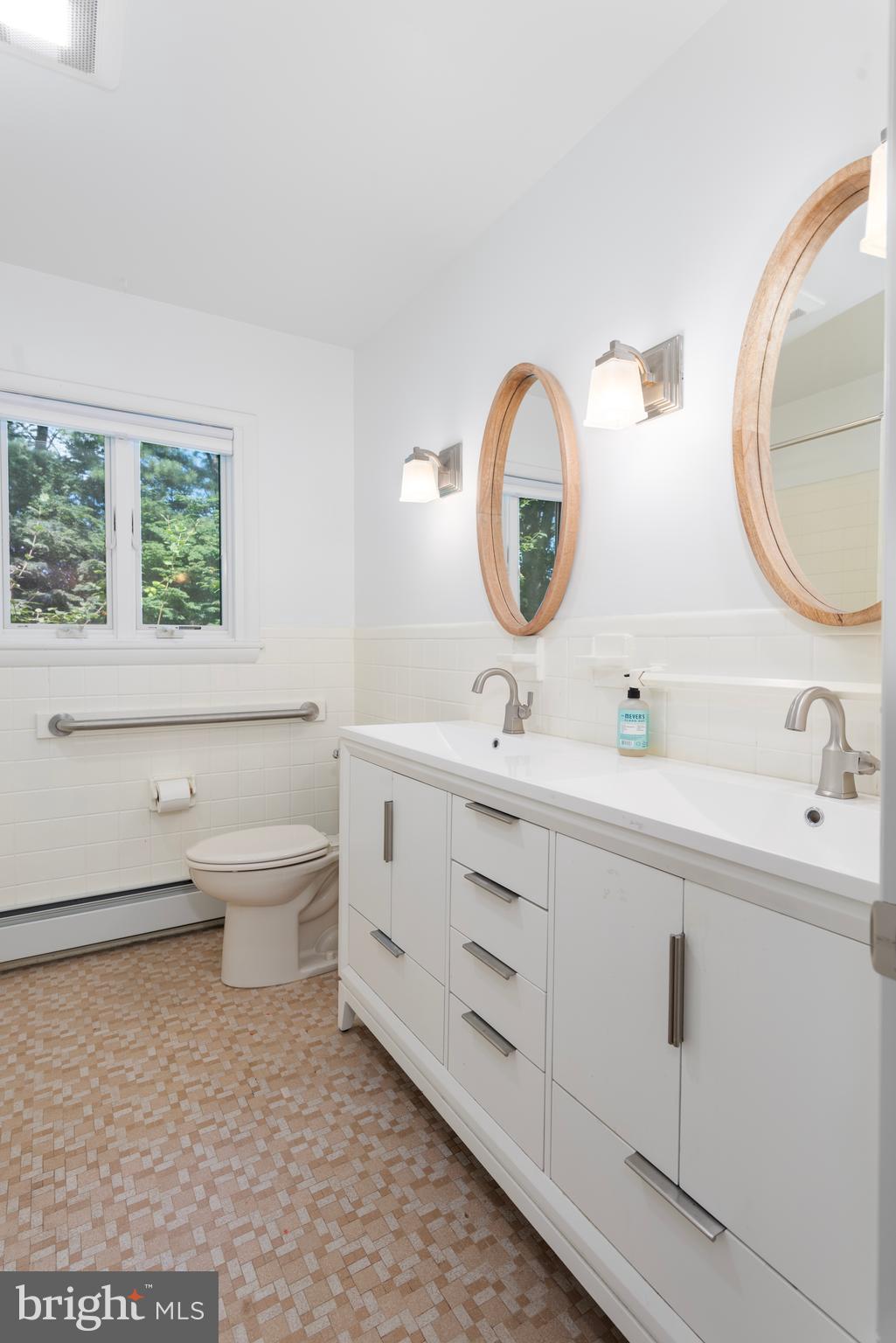 25800 Collins Avenue Chestertown, MD 21620 - Photo 18 of 31 a bathroom with a toilet a sink and a mirror