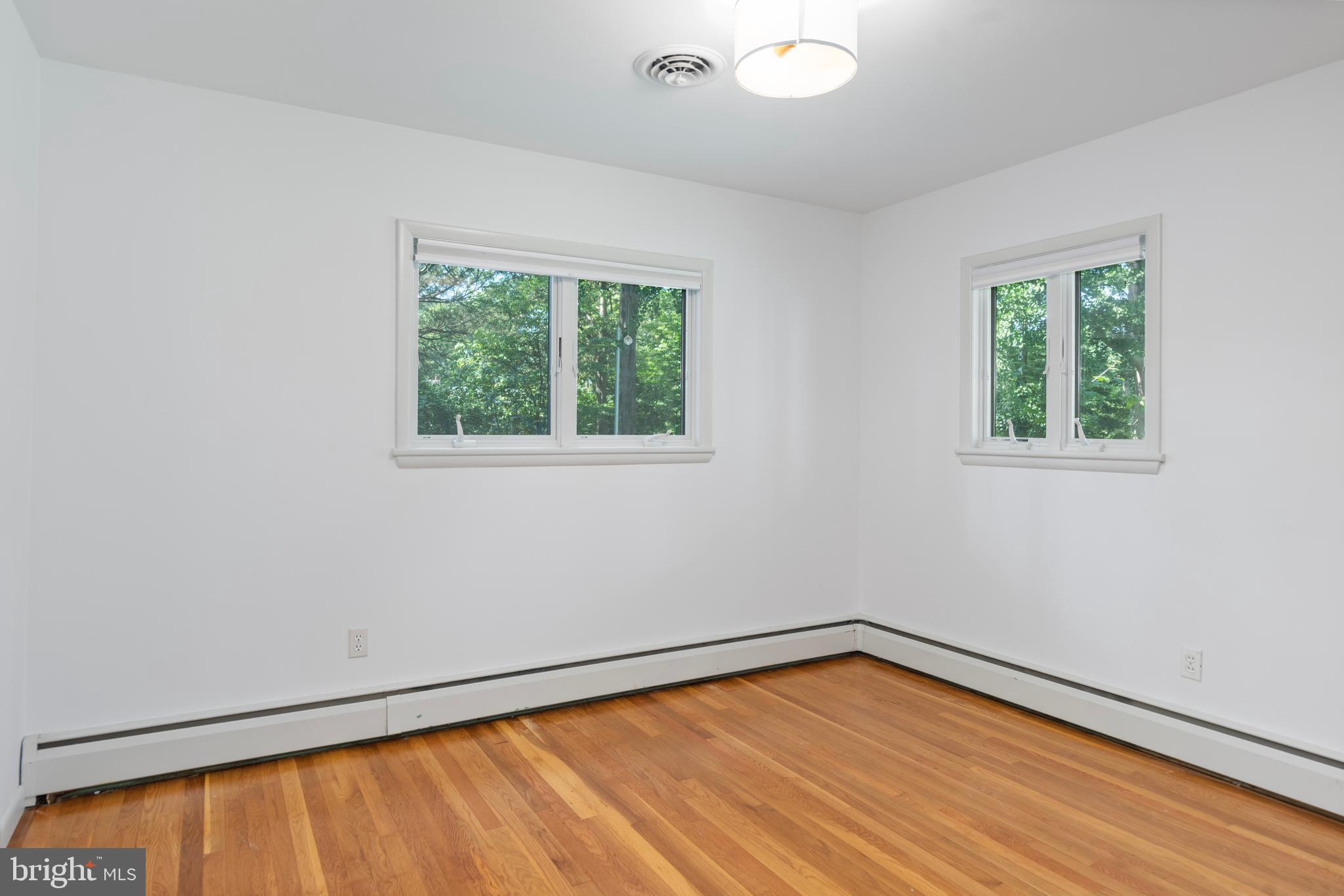 25800 Collins Avenue Chestertown, MD 21620 - Photo 20 of 31 a view of an empty room with wooden floor and a window